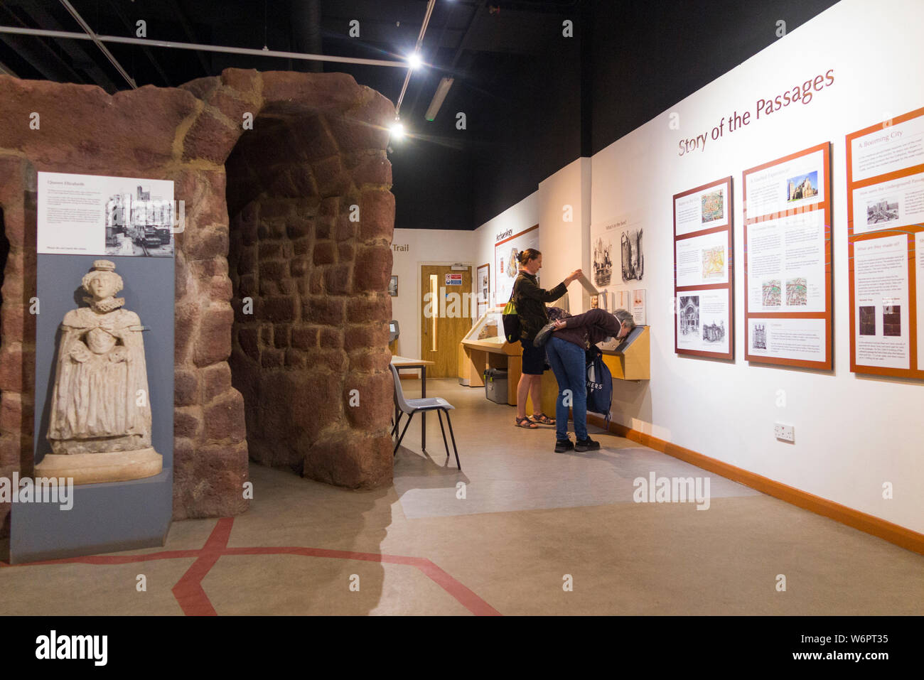 Tourists and visitors inside the Heritage Centre at the start of Exeter