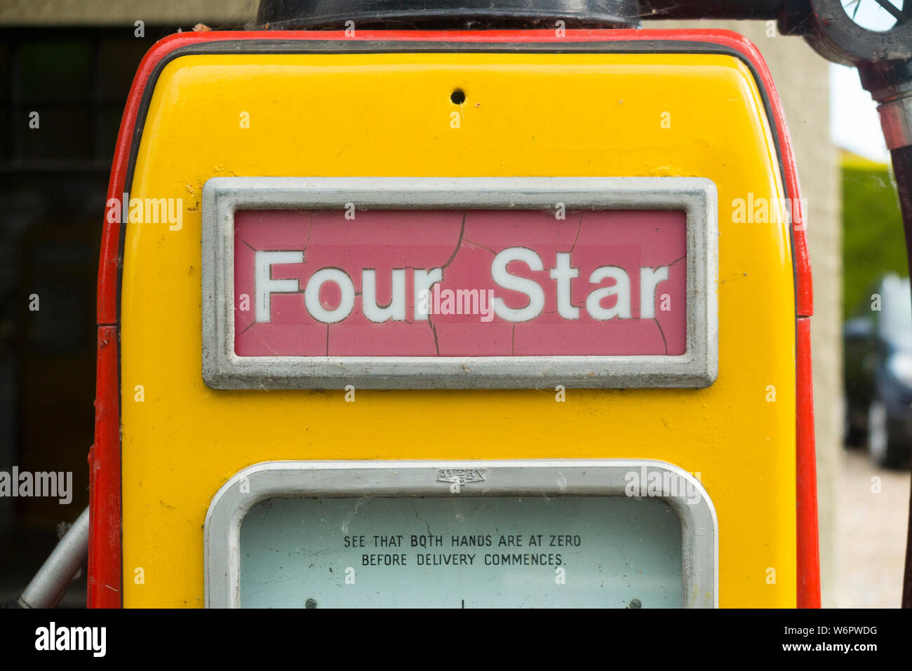 An old classic and obsolete Shell four star pump / vintage 4 star petrol pumps at filling station garage forecourt. UK. (110) Stock Photo