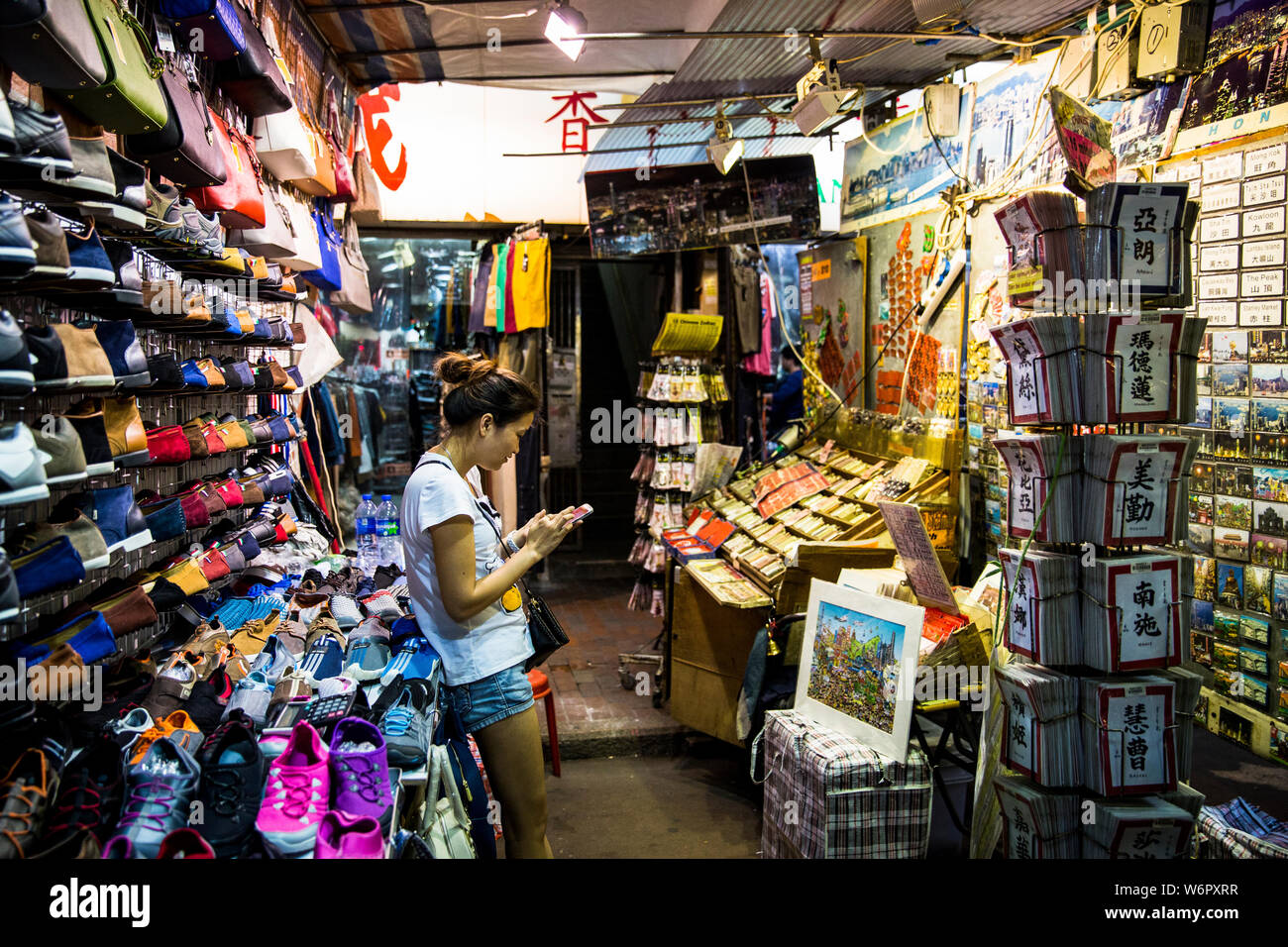 Shoes and merchandising stall at Temple Street night market. Hong Kong  Stock Photo - Alamy