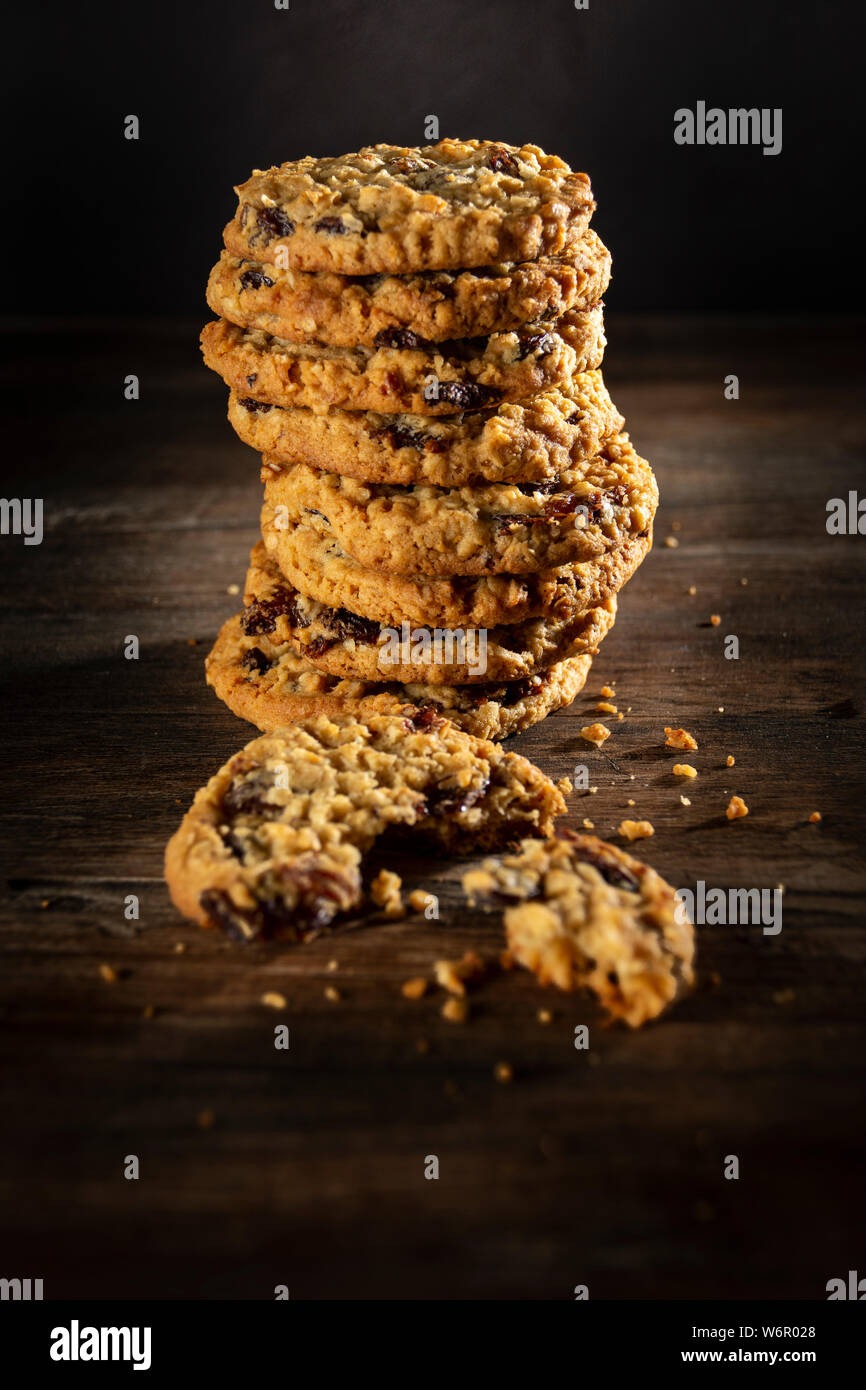 A freshly baked stack of farmhouse kitchen oat and raisin cookies. Stock Photo