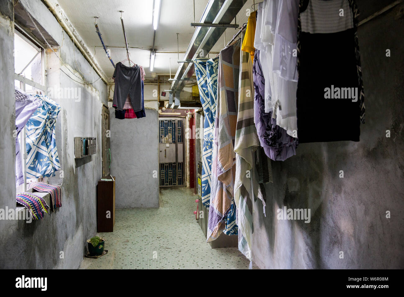 Clothes drying in a hallway of Chunking Mansions. Hong Kong Stock Photo
