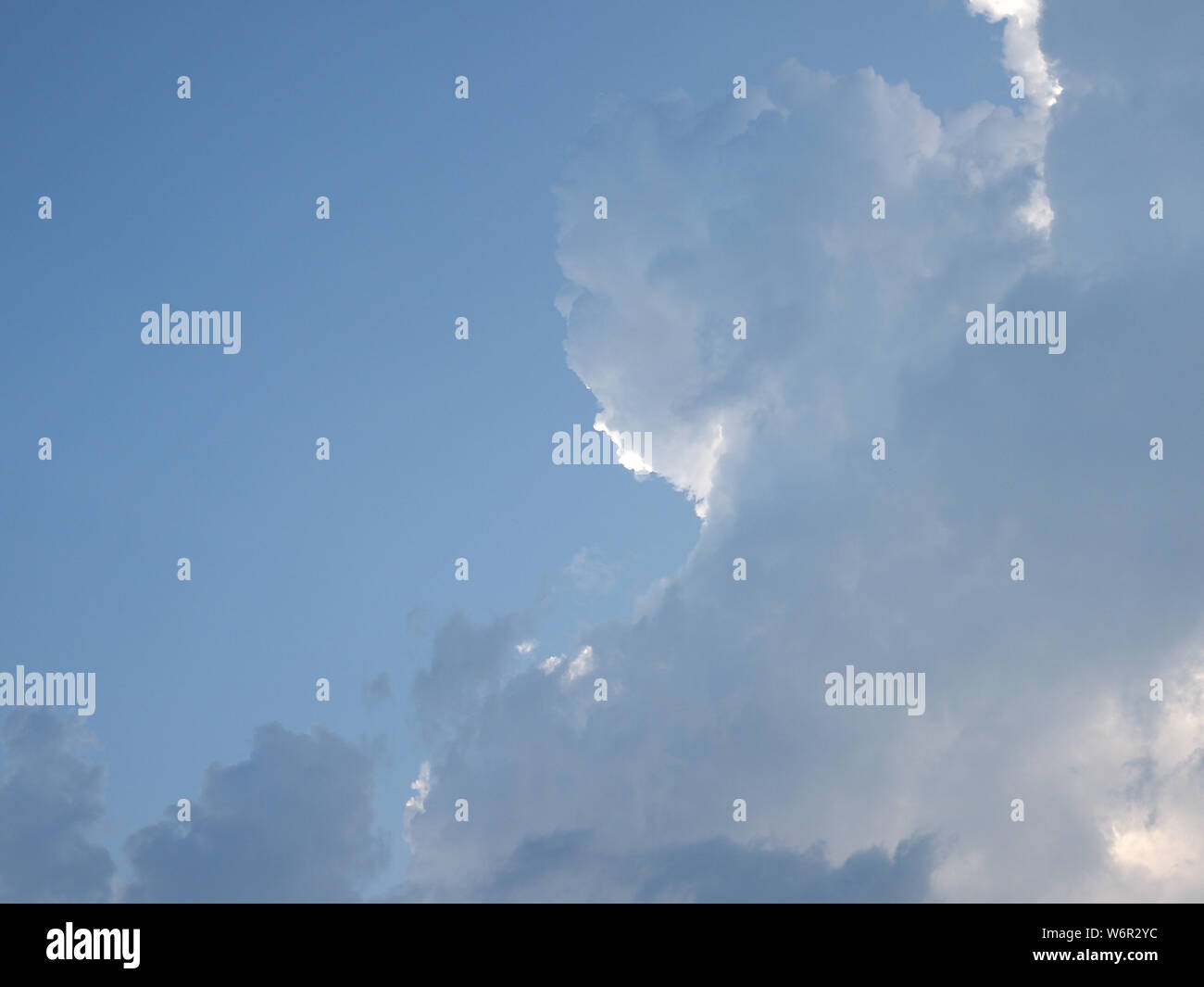 blue sky with clouds useful as a background Stock Photo - Alamy
