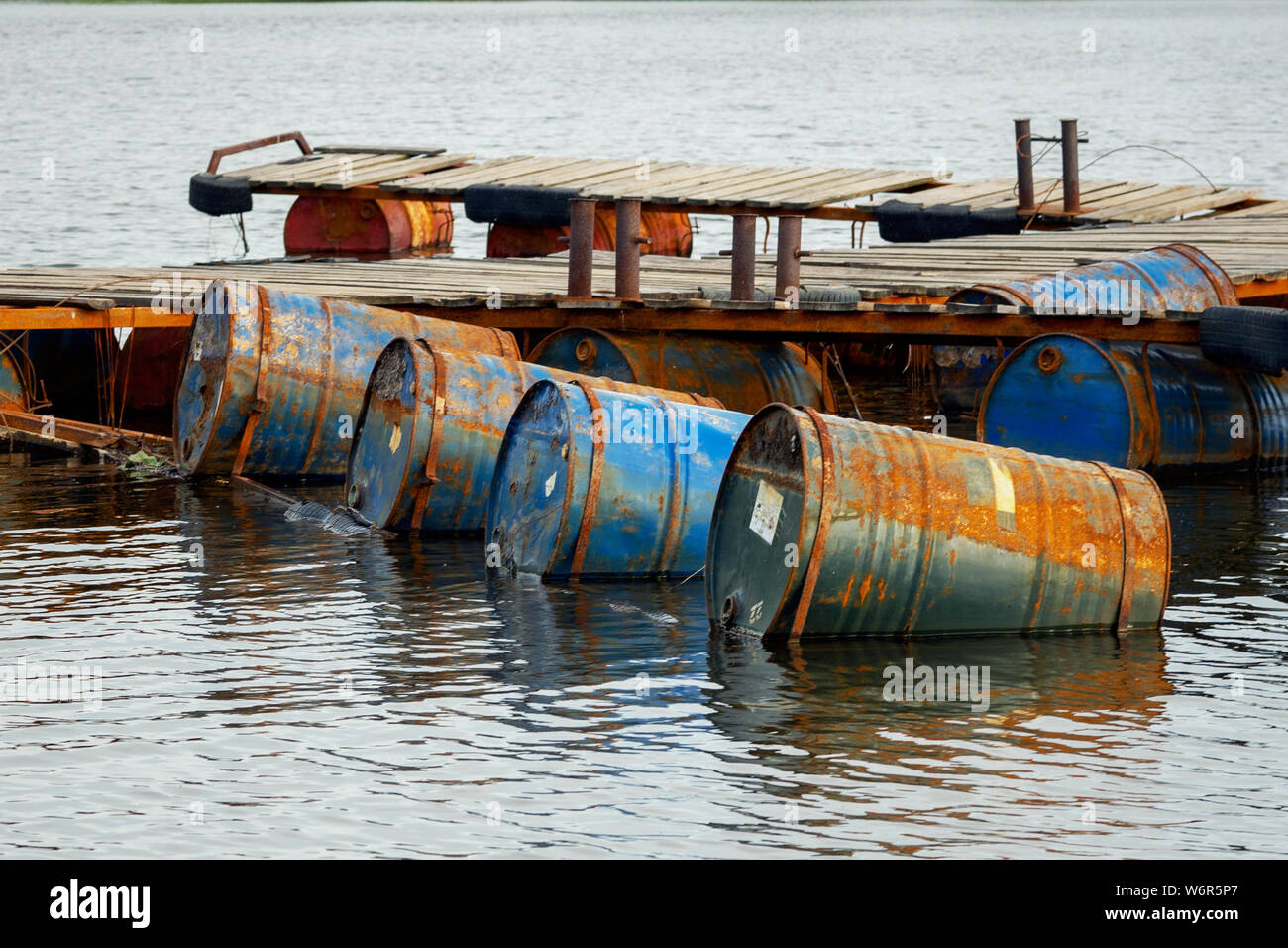 dumped oil drums cause pollution in the water, more and more the water
