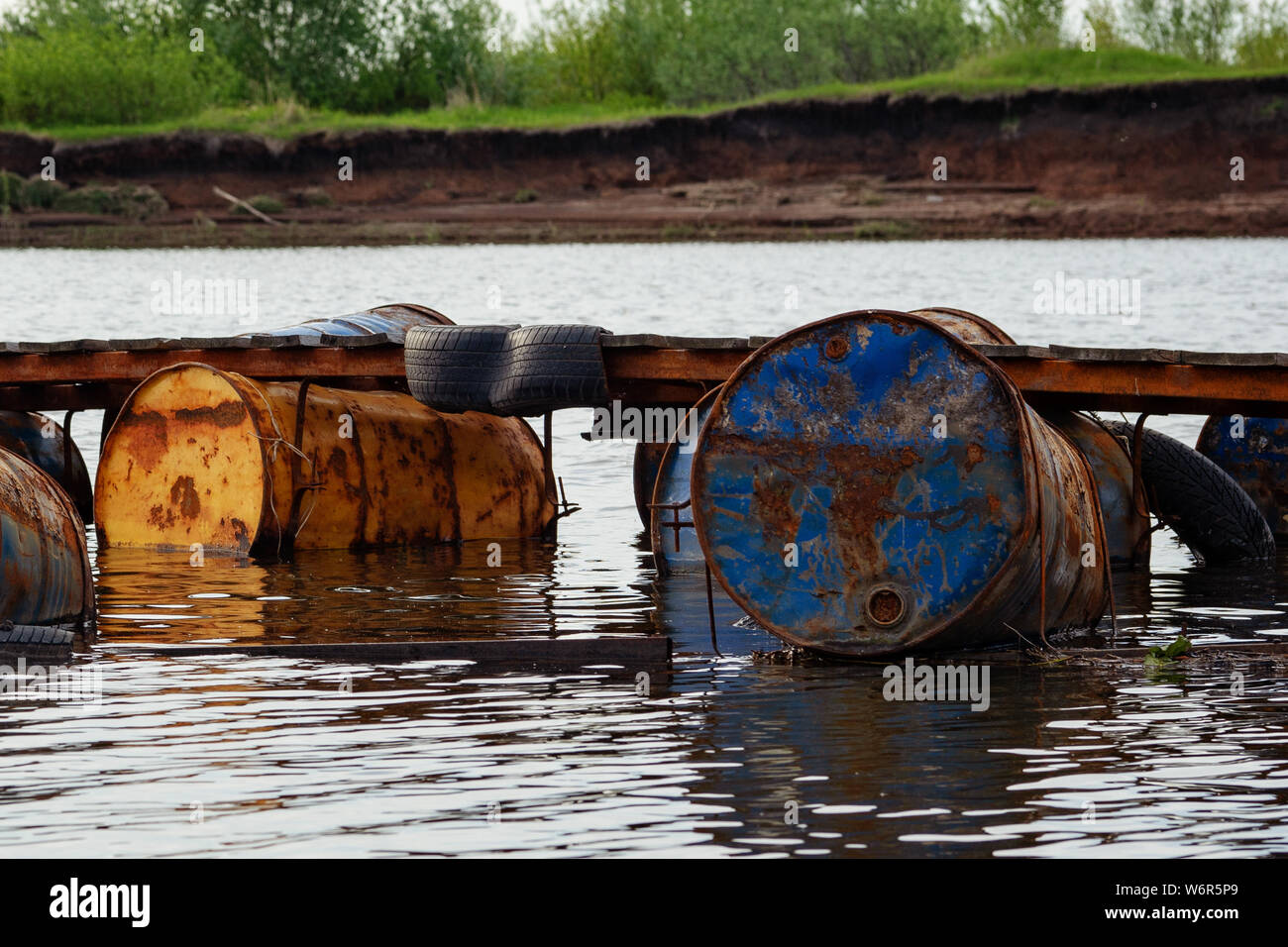 dumped oil drums cause pollution in the water, more and more the water