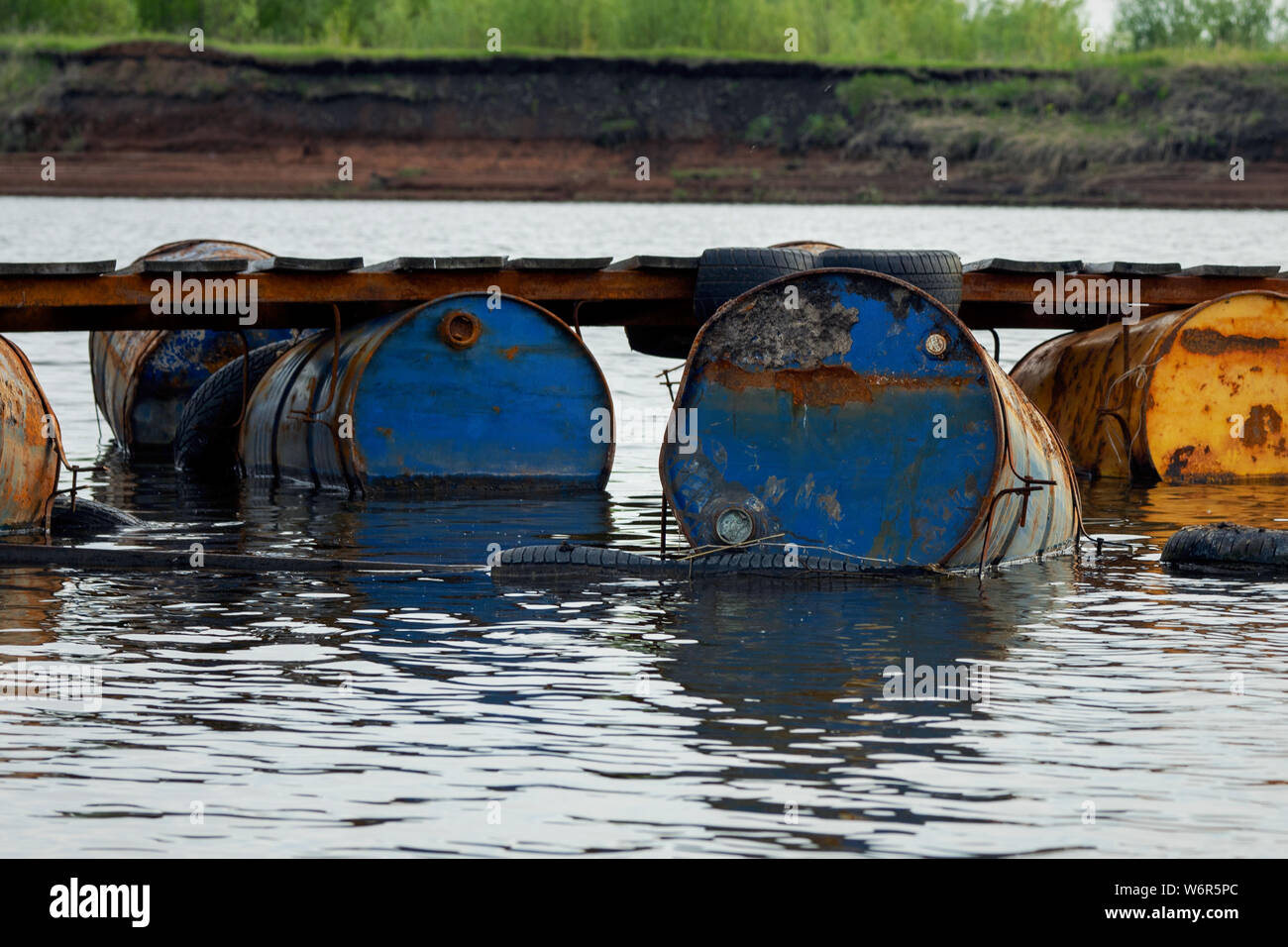 dumped oil drums cause pollution in the water, more and more the water