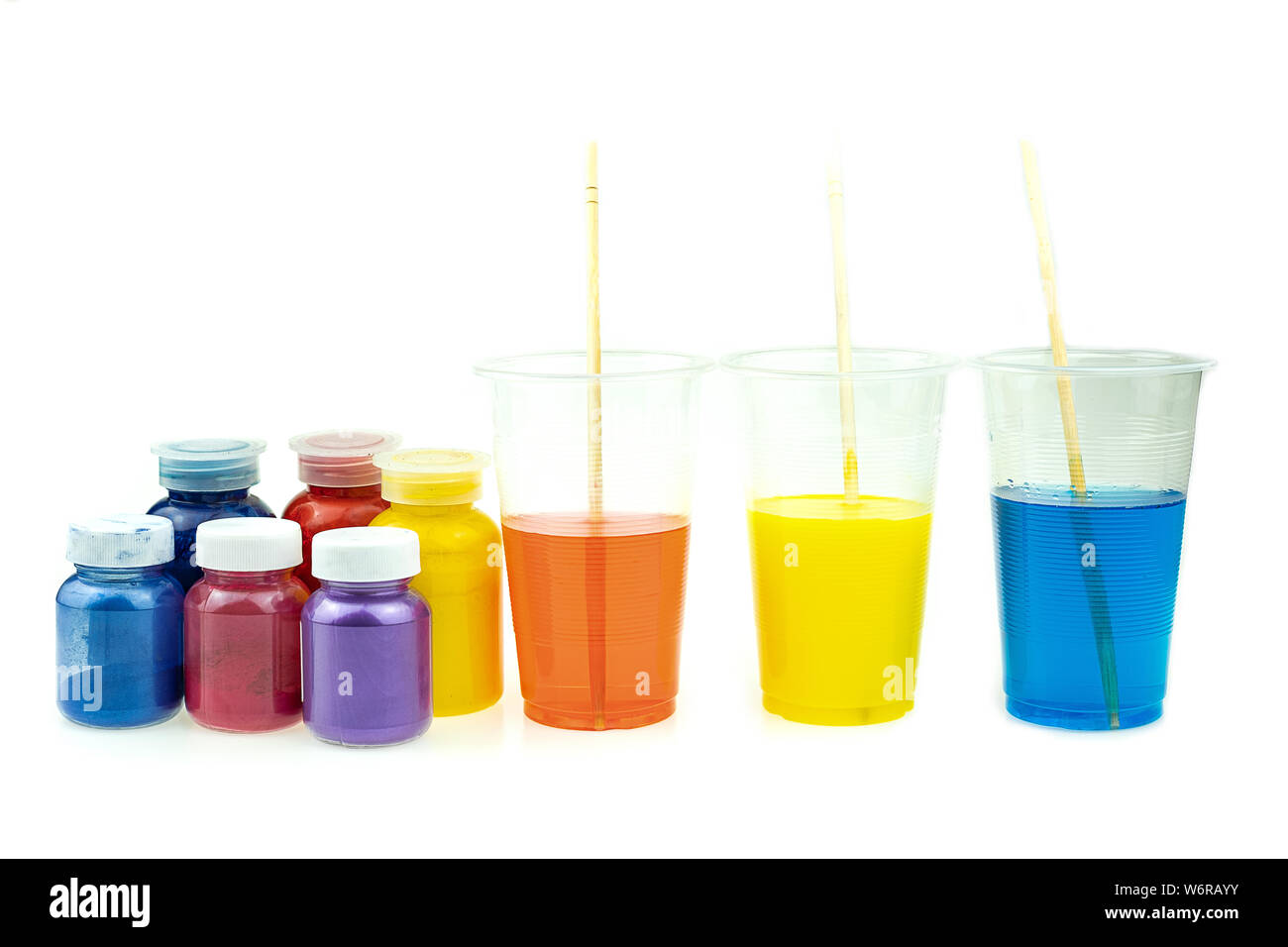 Mixing color epoxy resin in plastic cup for casting Stabilizing wood