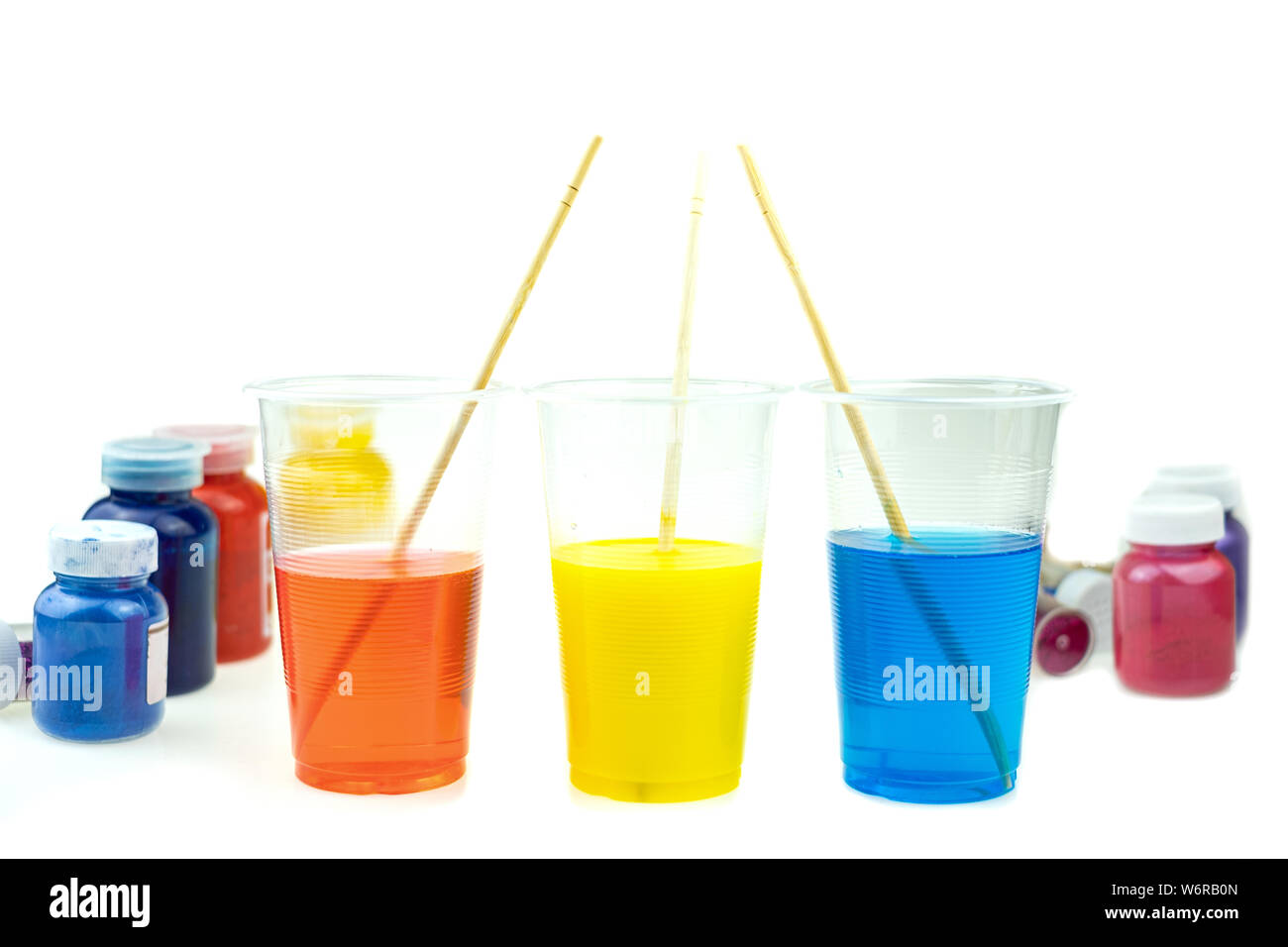 Mixing color epoxy resin in plastic cup for casting Stabilizing wood