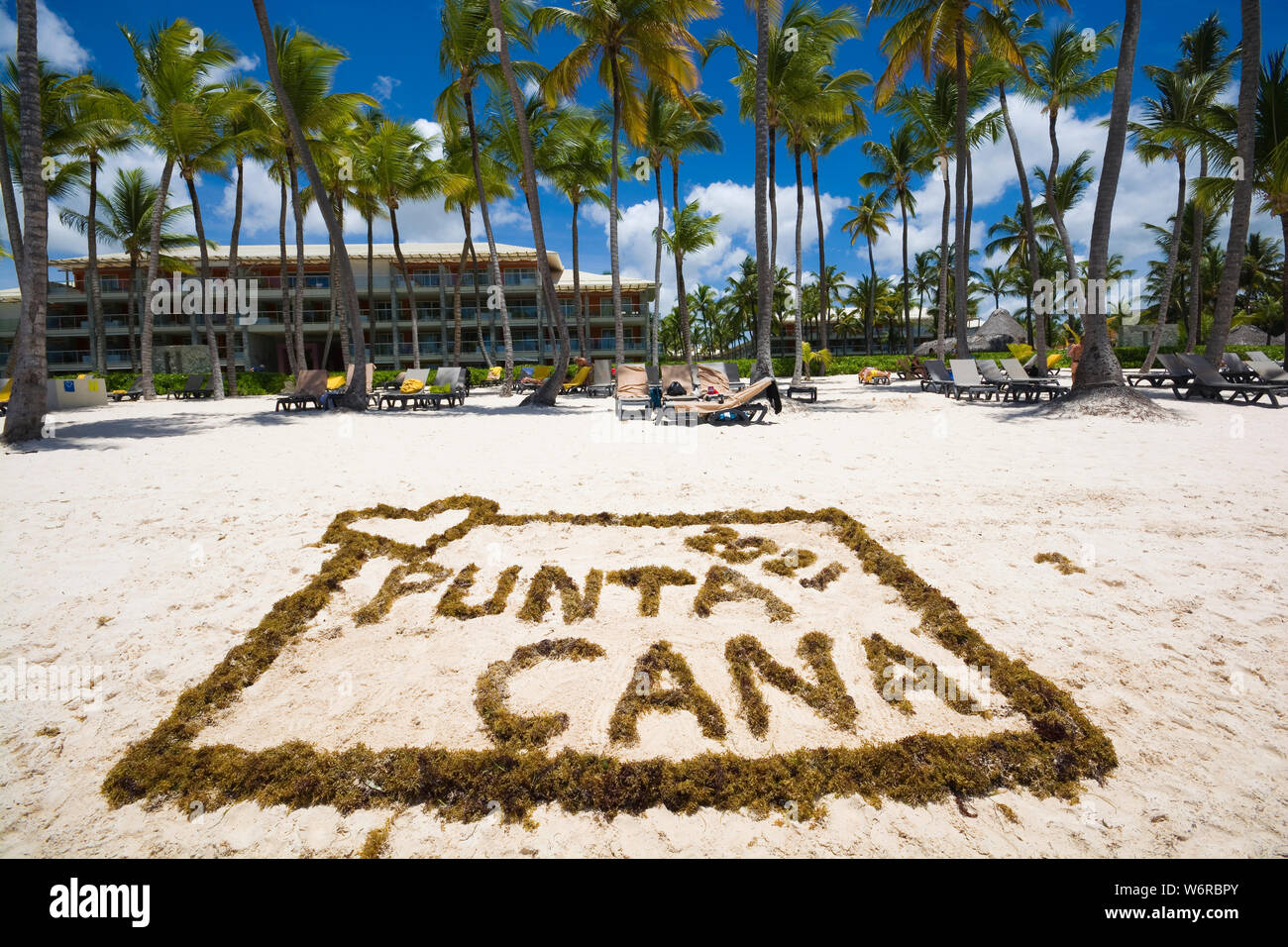 Inscription PUNTA CANA 2021 and heart made of sargassum algae on