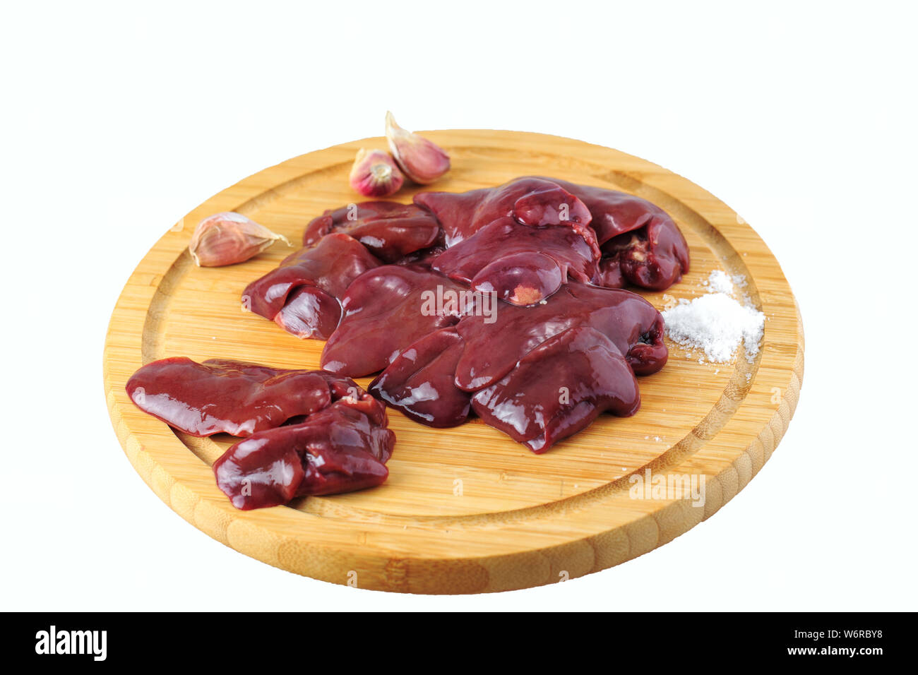 chicken liver on a wooden board on a white background Stock Photo