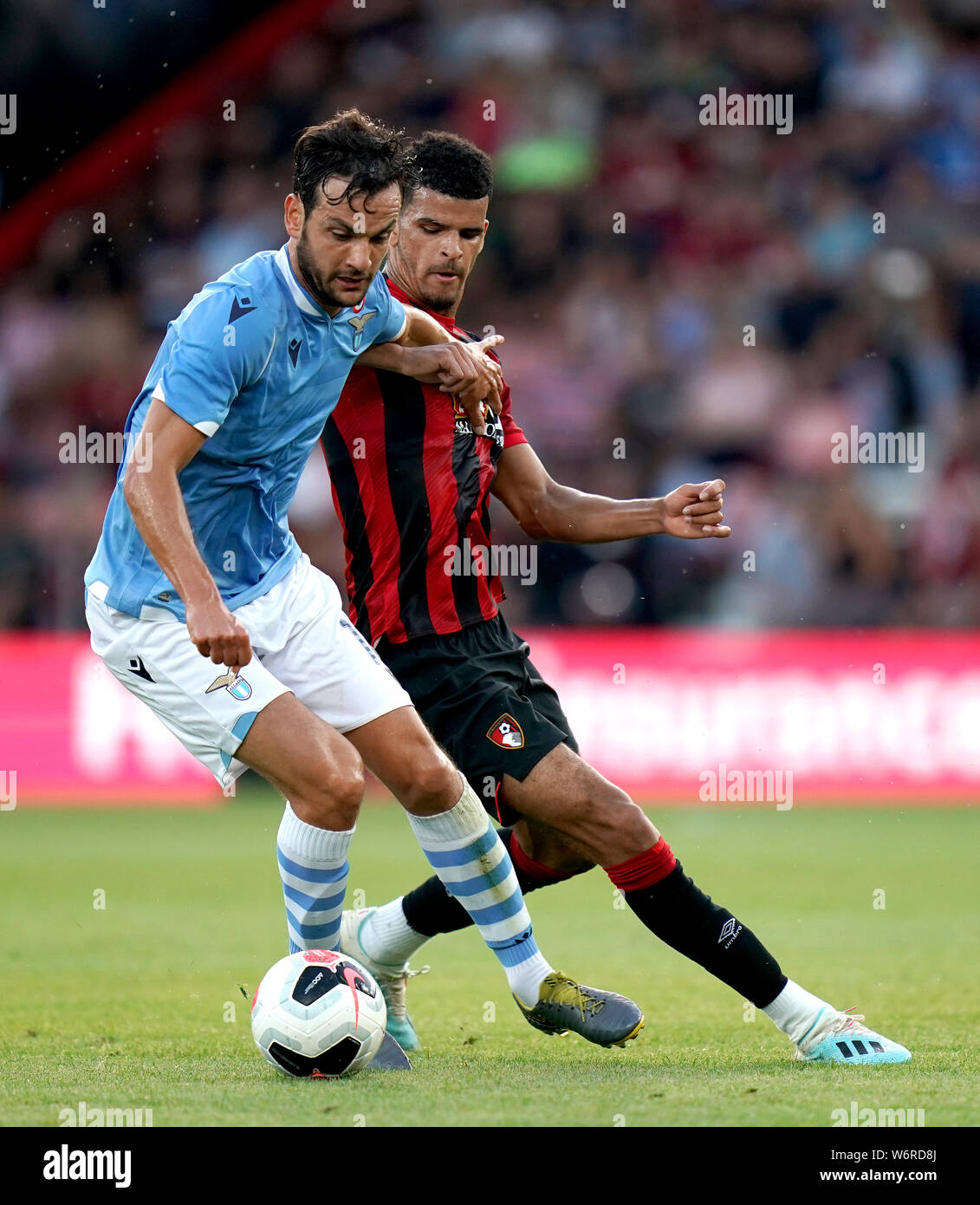 Lazio's Marco Parolo battles for possession of the ball with Bournemouth's Dominic Solanke, (right) during the Pre-Season match at the Vitality Stadium, Bournemouth. Stock Photo