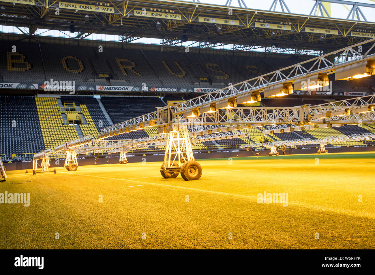 Signal-Iduna-Park, Westfalenstadion, football stadium of BVB Borussia Dortmund, the lawn of the pitch is illuminated with special lamps, for lawn care Stock Photo