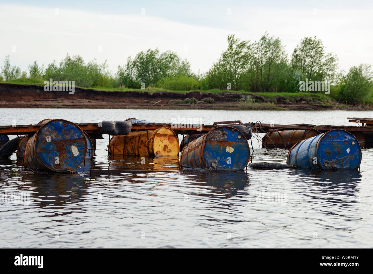 dumped oil drums cause pollution in the water, more and more the water