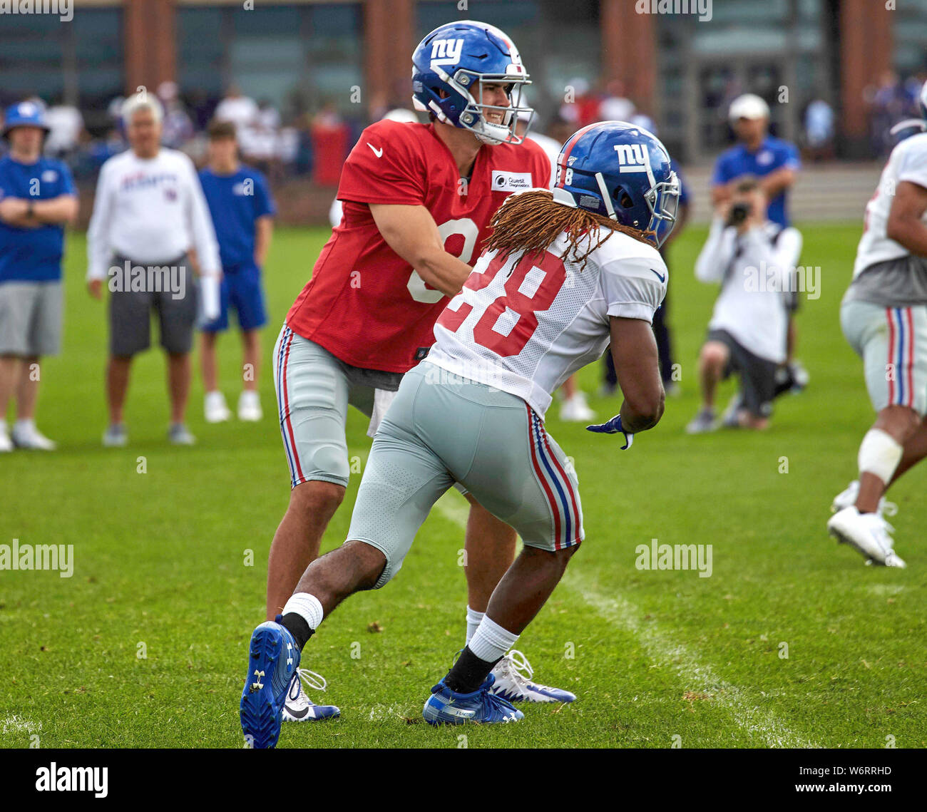 East Rutherford, New Jersey, USA. 02nd Aug, 2019. New York Giants quarterback Daniel Jones (8) hands off to running back Paul Perkins (28) during training camp at the Quest Diagnostics Training Center in East Rutherford, New Jersey. Duncan Williams/CSM Credit: Cal Sport Media/Alamy Live News Stock Photo