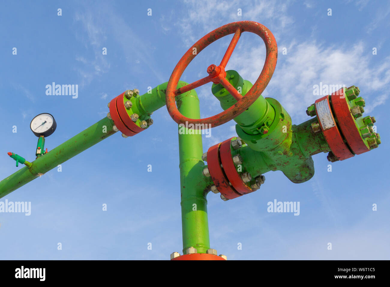 Horizontal view of a wellhead with valve armature. Oil and gas industry ...
