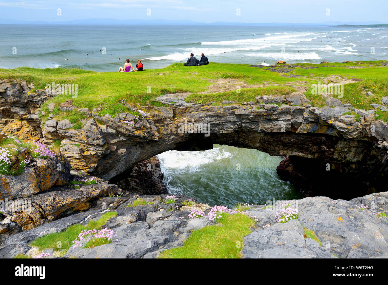 Fairy bridges, impressive stone arches near Tullan Strand, one of Donegal's surf beaches, framed by a scenic back drop provided by the Sligo-Leitrim M Stock Photo