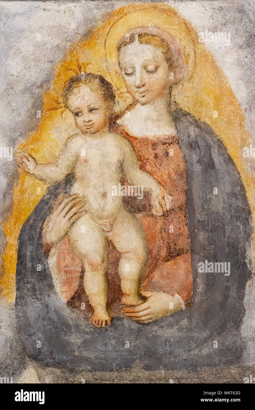 A fresco of the Virgin Mary with Infant Jesus in the 'Santa Maria del Carmine' church (Holy Mary of Carmel) in Pavia. Stock Photo