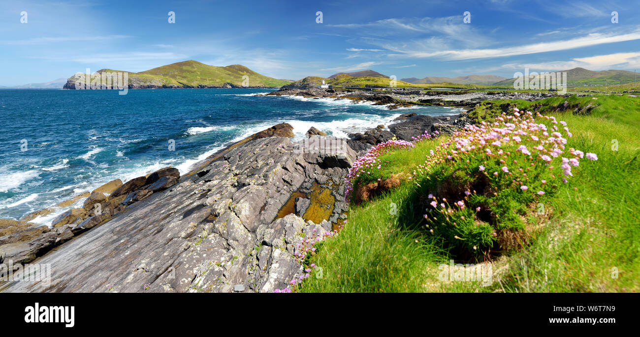 Beautiful view of Valentia Island Lighthouse at Cromwell Point. Locations worth visiting on the Wild Atlantic Way. Scenic Irish countyside on sunny su Stock Photo