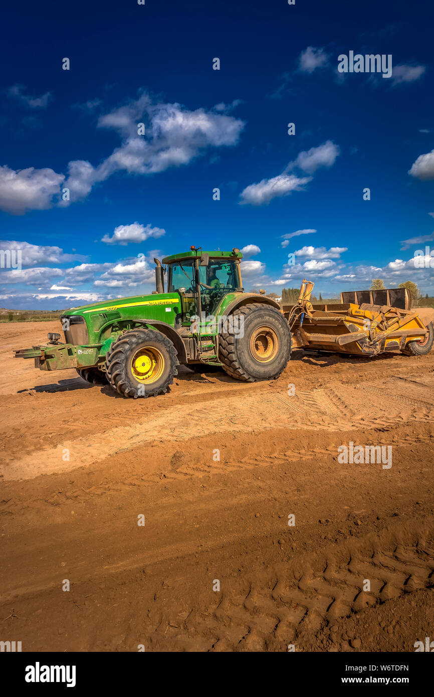 Tractors leveling in the field Stock Photo Alamy