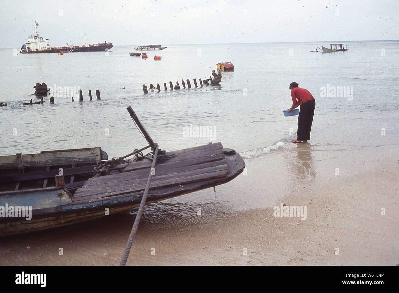 Wrecks line the coast at Pa;au Bidong, Malaysia, where Vietnamese fleeing Vietnam in 1979 after the defeat in South Vietnam Stock Photo
