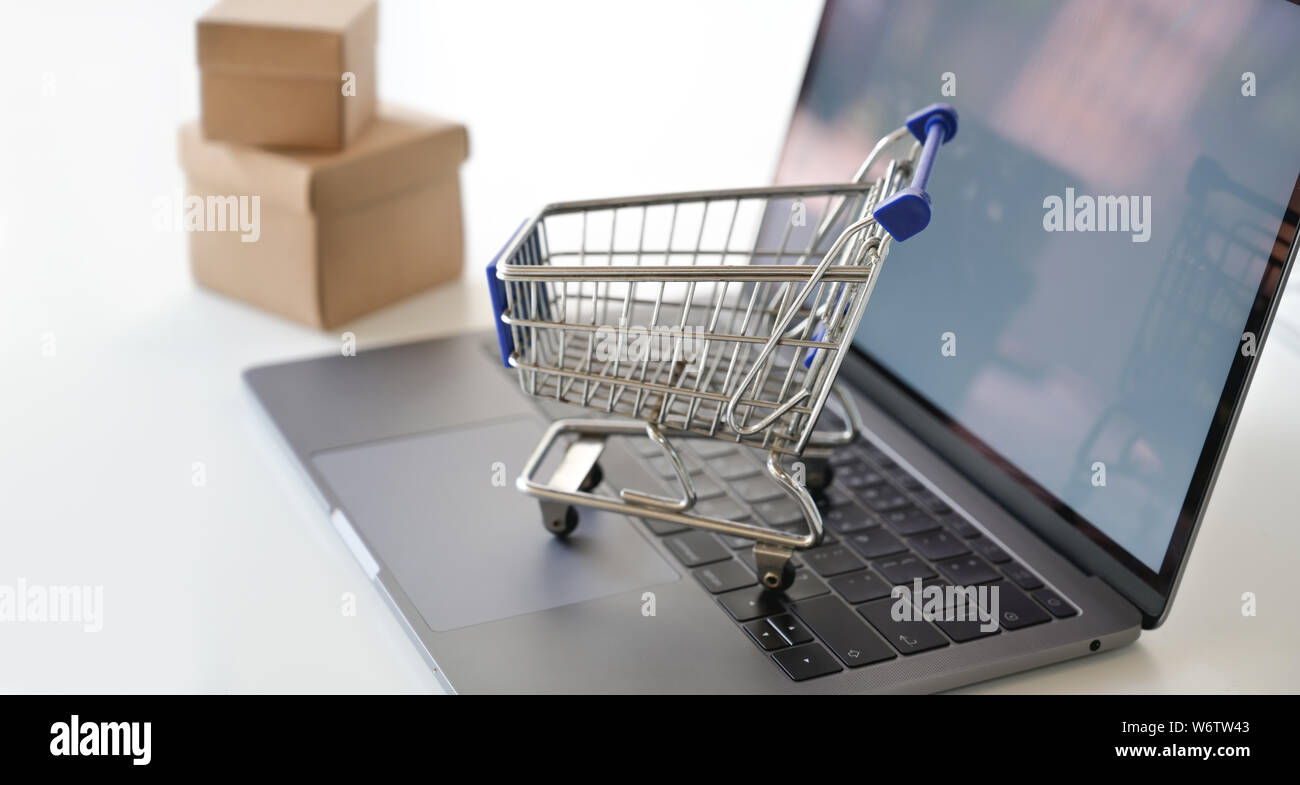 Shopping online concept mock up shopping cart on laptop Stock Photo