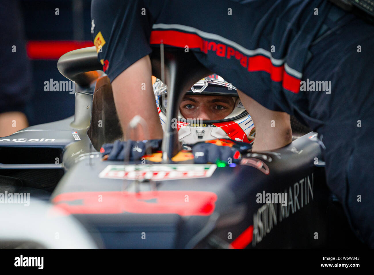 Red Bull Racing’s Dutch driver Max Verstappen seats in his car during the second practice session of the Hungarian F1 Grand Prix. Stock Photo