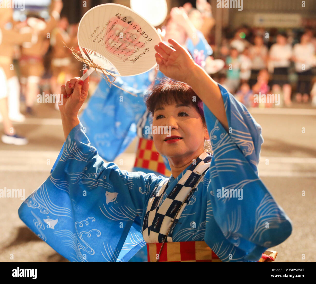 Fukushima, Japan. 2nd Aug, 2019. A woman dances during the parade of Fukushima Waraji (straw sandals) Festival in Fukushima, Japan, Aug. 2, 2019. The Fukushima Waraji Festival started in 1970 and kicked off its 50th anniversary this summer. This event is a ritual held by locals to pray for the good health of the citizens and prosperity for the business. Credit: Du Xiaoyi/Xinhua/Alamy Live News Stock Photo