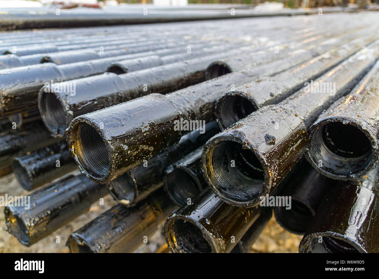 Offshore Industry oil and gas production petroleum pipeline. Downhole drilling  rig. Laying the pipe on the deck. View of the shell of drill pipes laid  Stock Photo - Alamy