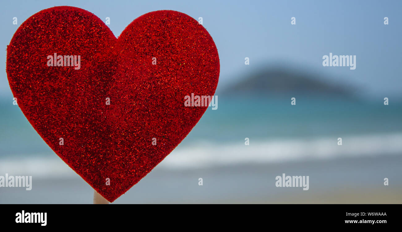 heart shaped flier on the beach for valentine day background with out of focus beach  Goa India Stock Photo