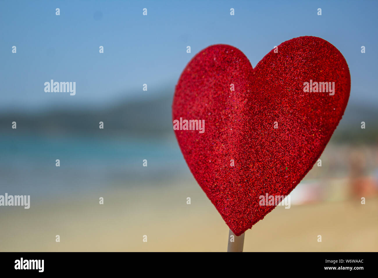 heart shaped flier on the beach for valentine day background with out of focus beach  Goa India Stock Photo
