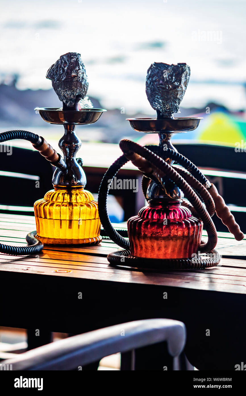 set of hookah shisha smoke on beach background in Goa for travellers