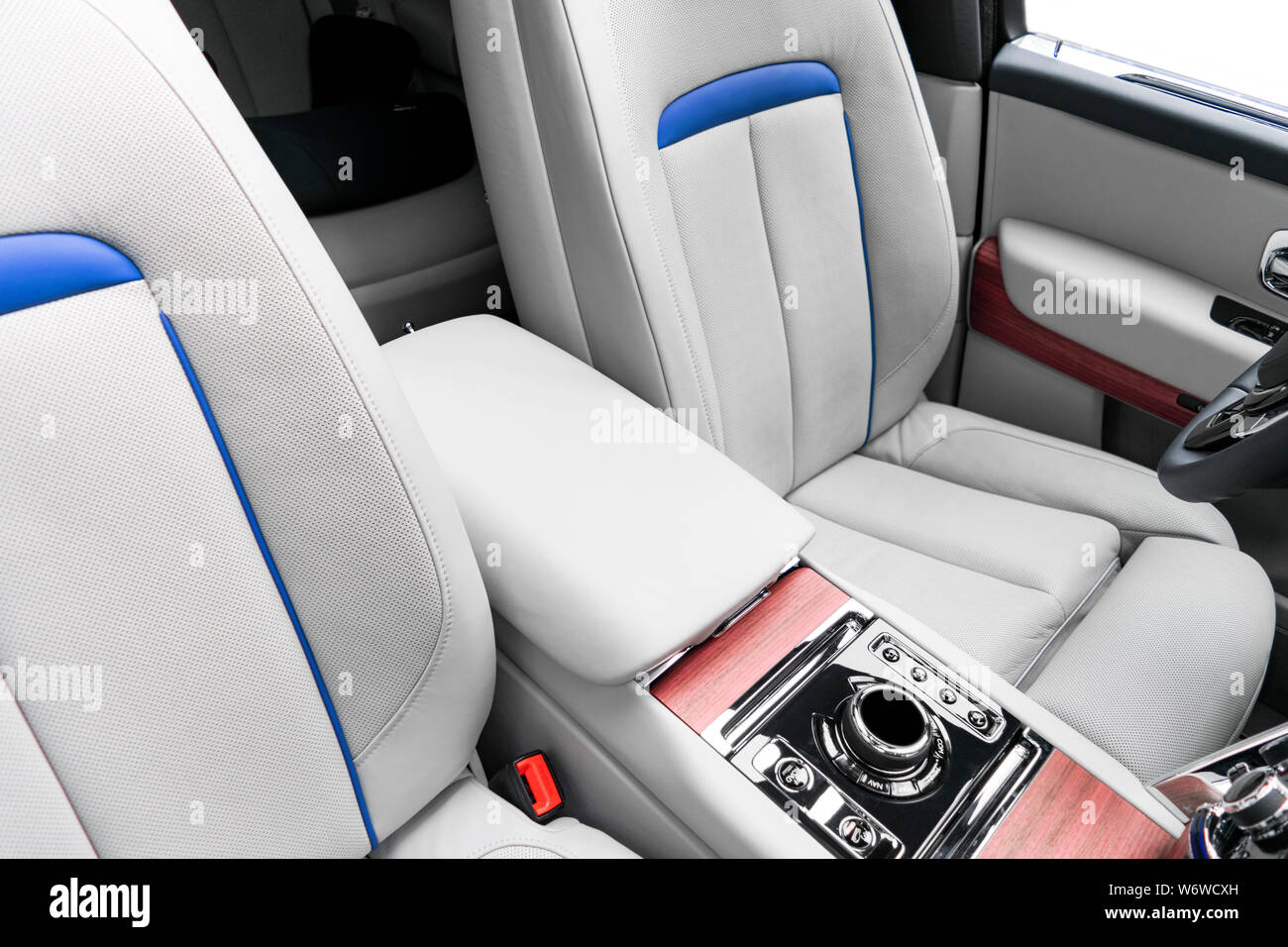 Modern luxury car white leather interior with natural wood panel. Part