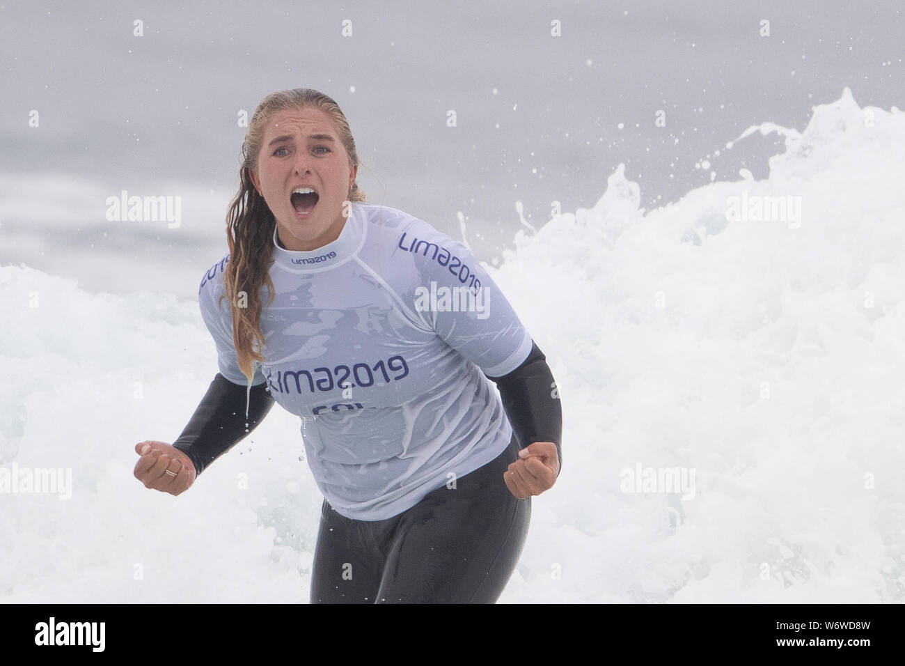 Punta Rocas, Peru. 01st Aug, 2019. Isabella Gomez of Columbia celebrates her performance in the Women's Surf Open repechaje during the Pan American Games Surfing Preliminary Rounds at Punta Rocas, Peru. Daniel Lea/CSM Credit: Cal Sport Media/Alamy Live News Stock Photo