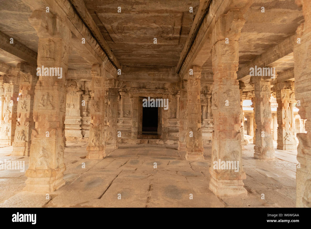 Stone piller showing of ancient architecture inside the ruined krishna temple at Hampi, India. Stock Photo