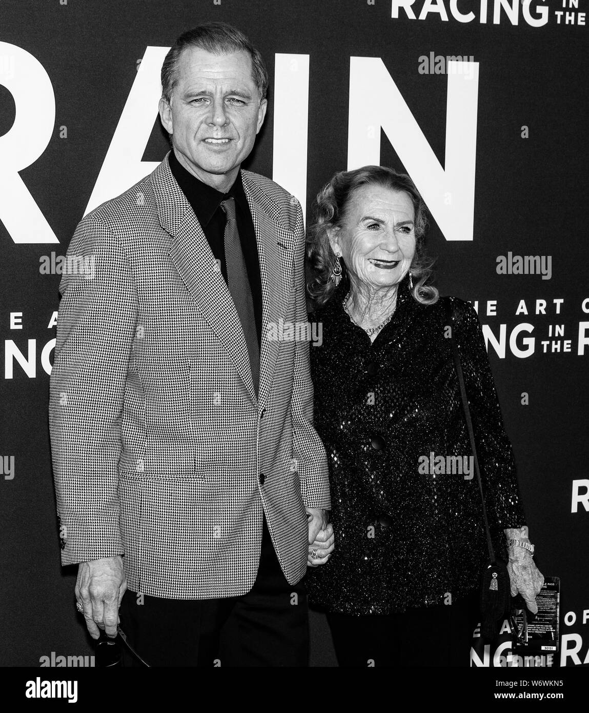 Los Angeles, CA - August 01, 2019: Maxwell Caulfield and Juliet Mills attend the premiere Of  'The Art of Racing in the Rain' held at El Capitan Theat Stock Photo