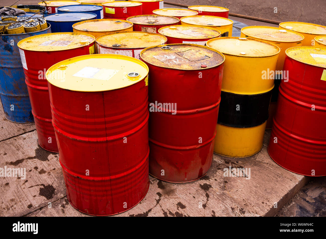 colored metal barrels. Blue oil drums containing fuel for