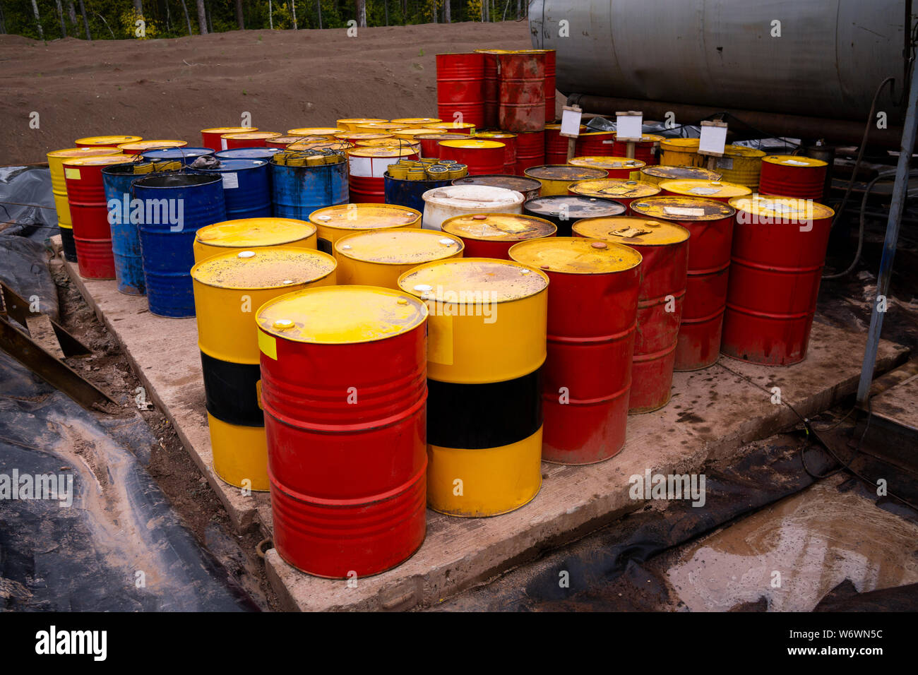 colored metal barrels. Blue oil drums containing fuel for