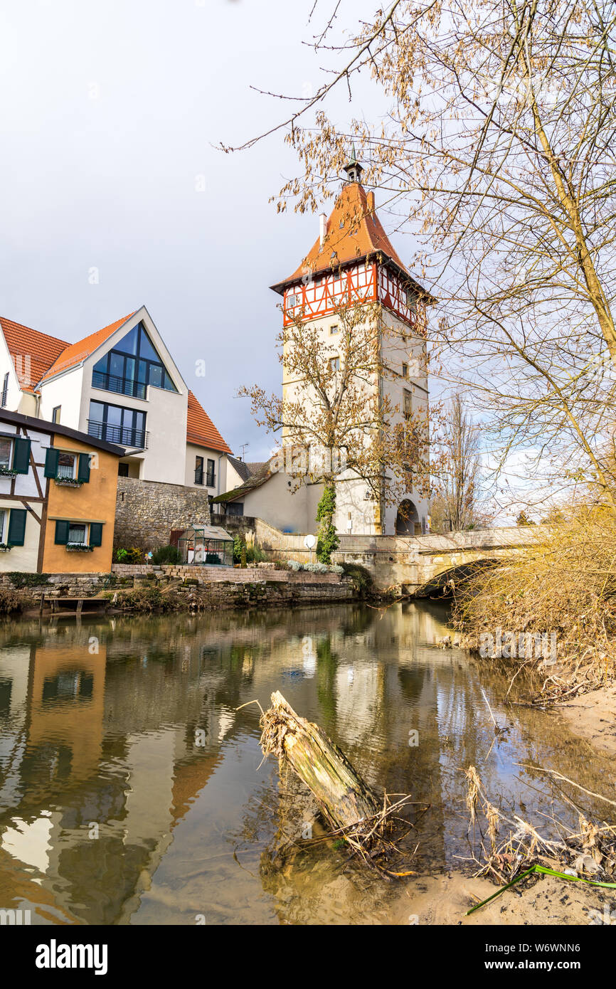 Germany, Old city gate of waiblingen reflecting in water of river rems Stock Photo