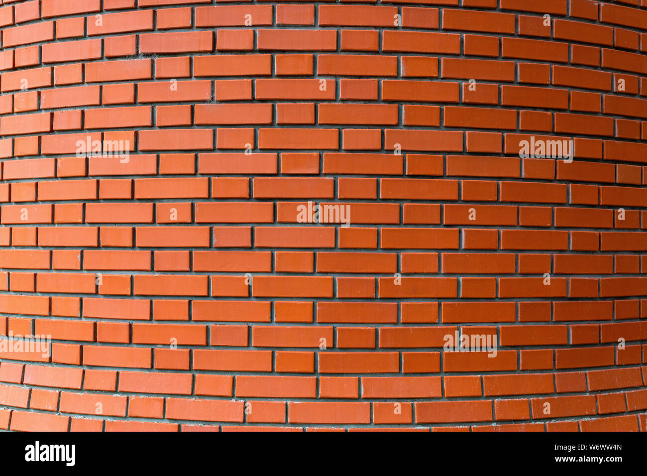 Red brick wall background for design. Bricks are bound by cement mortar. Close up view Stock Photo - Alamy