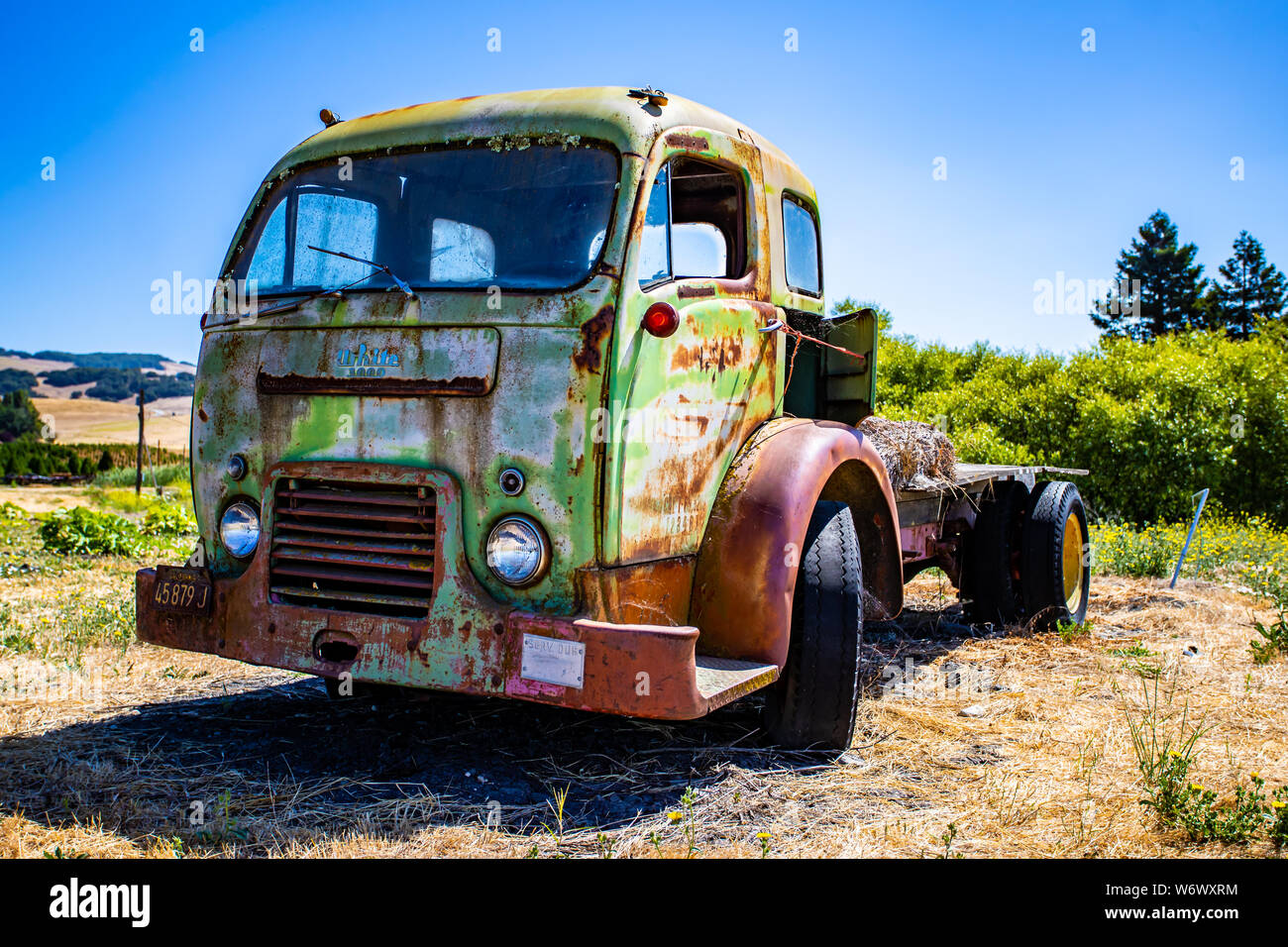Abandoned old trucks are left in fields along Adobe Road, Sonoma, California Stock Photo