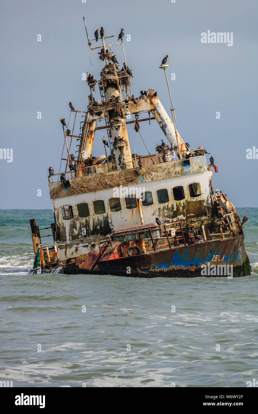 One of many rusting ship (Zelia India) hulls along the Skeleton Coast. Stock Photo