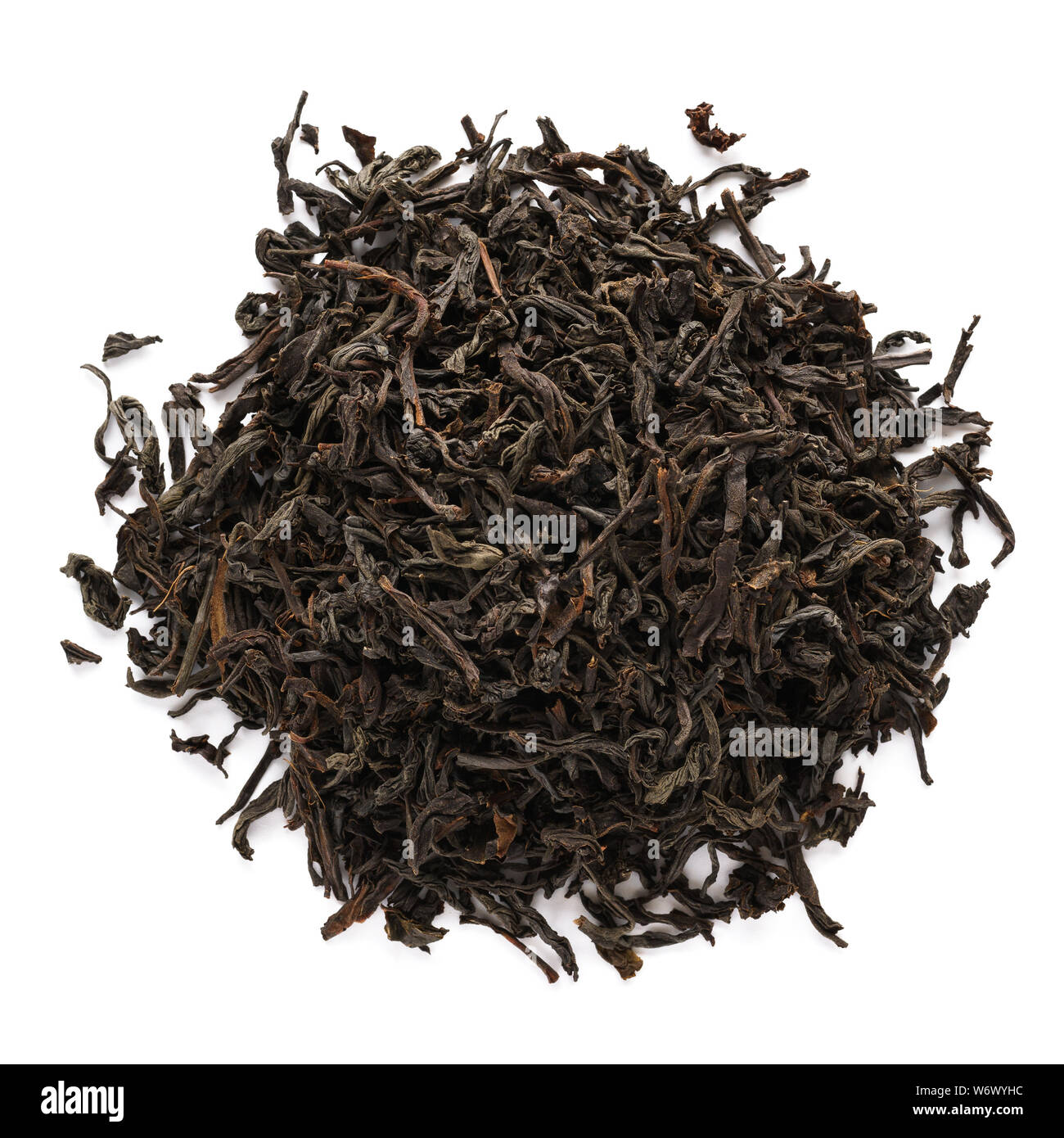 Dry black tea leaves isolated on white background. Top view. Stock Photo