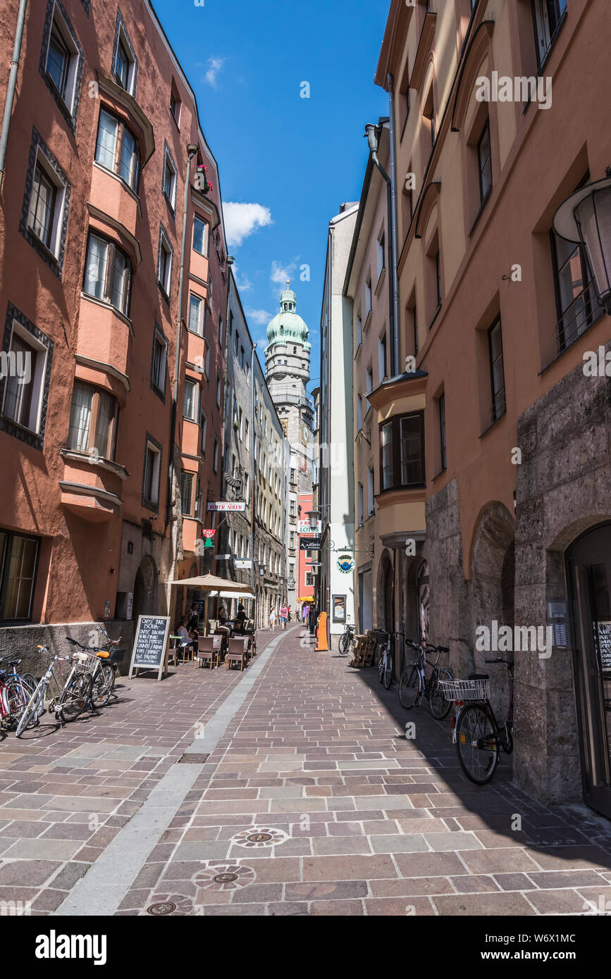 Street scenes in the Alte Stadt part of the old city of Innsbruck, looking towards the Alte Stadt tower Stock Photo