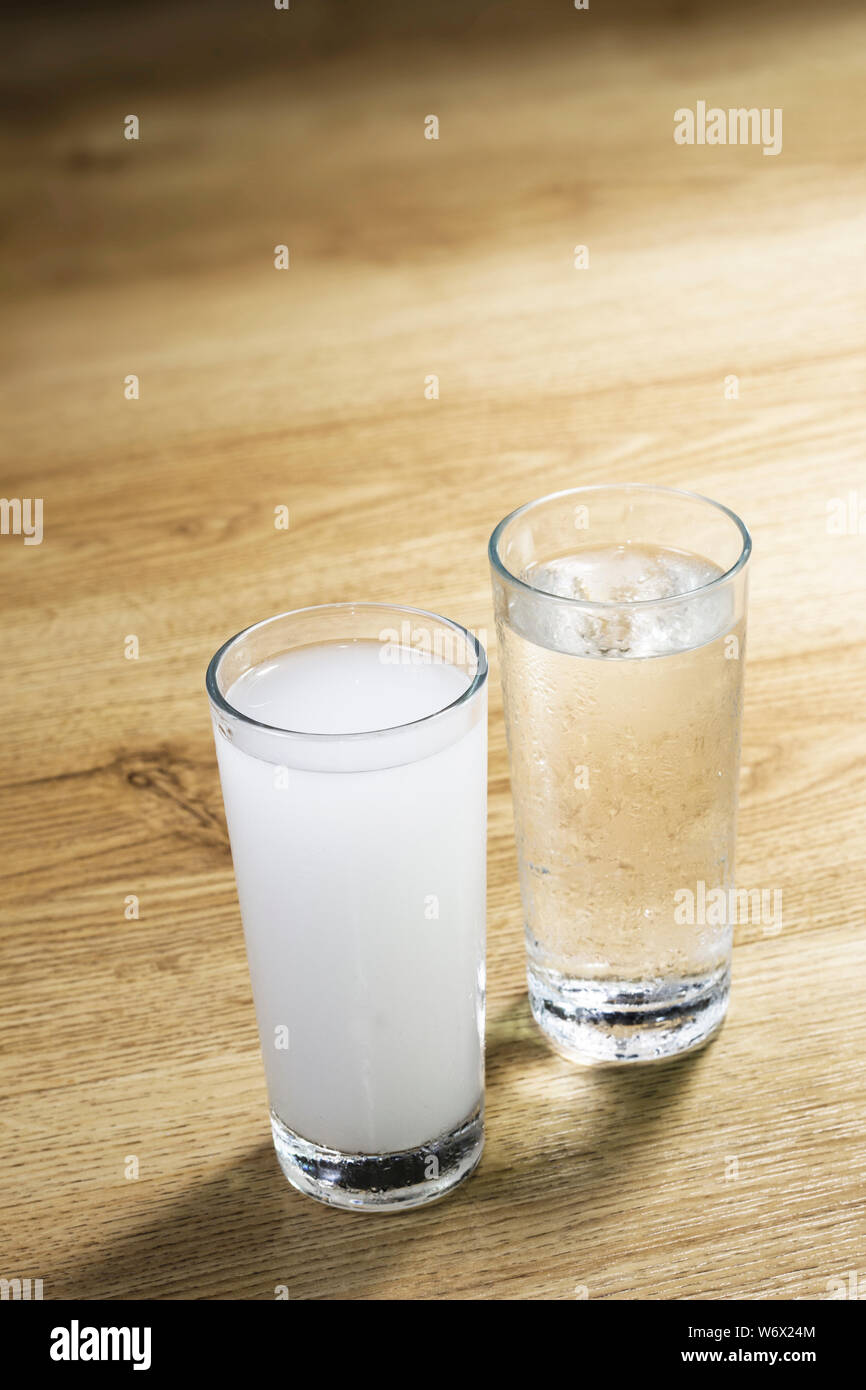 Turkish raki on wooden table Stock Photo
