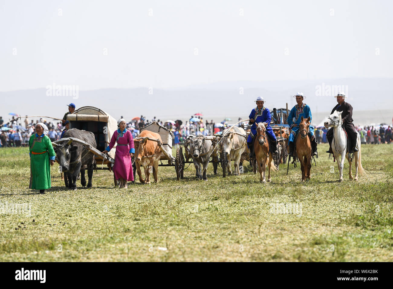 Xilinhot, China's Inner Mongolia Autonomous Region. 3rd Aug, 2019. Herdsmen display the local folk culture by pulling the "lele cart", a special Mongolian cart, during the opening ceremony of the Nadam Fair held in Xilinhot, Xilin Gol League, north China's Inner Mongolia Autonomous Region, Aug. 3, 2019. A series of activities, including horse riding contest, traditional archery contest and folk dress show will be held during the event. Credit: Liu Lei/Xinhua/Alamy Live News Stock Photo