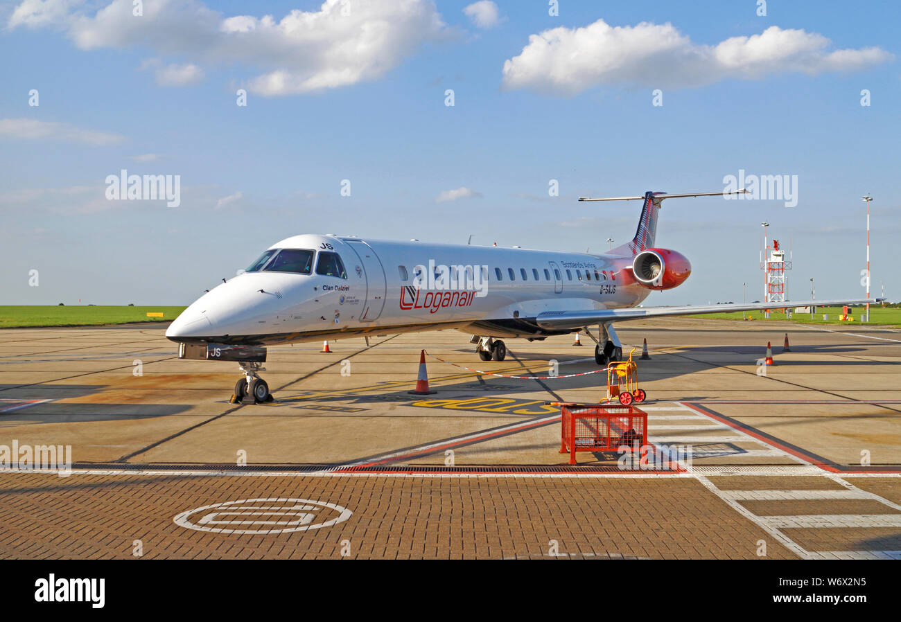 A Loganair Embraer EMB 145 on the apron at Norwich International Airport, Norwich, Norfolk, England, United Kingdom, Europe. Stock Photo
