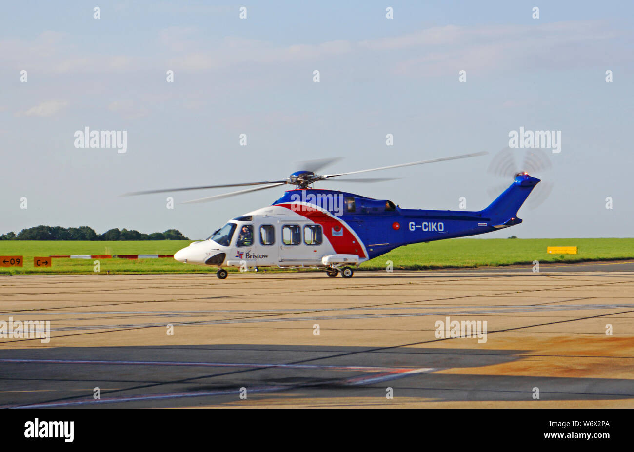 A Bristow AugustaWestland AW139 helicopter taxiing at Norwich International Airport, Norwich, Norfolk, England, United Kingdom, Europe. Stock Photo