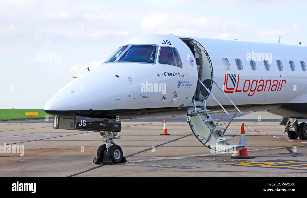 A Loganair Embraer EMB 145 with boarding steps down on the apron at Norwich International Airport, Norwich, Norfolk, England, United Kingdom, Europe. Stock Photo