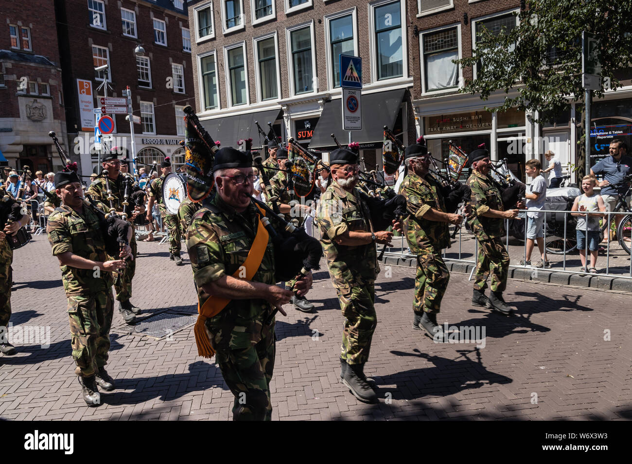 Military Pipes and Drums Falcon Guards Band in traditional ceremonial uniform performing and marching at parade on the 2018 Veterans' Day in The Hague Stock Photo