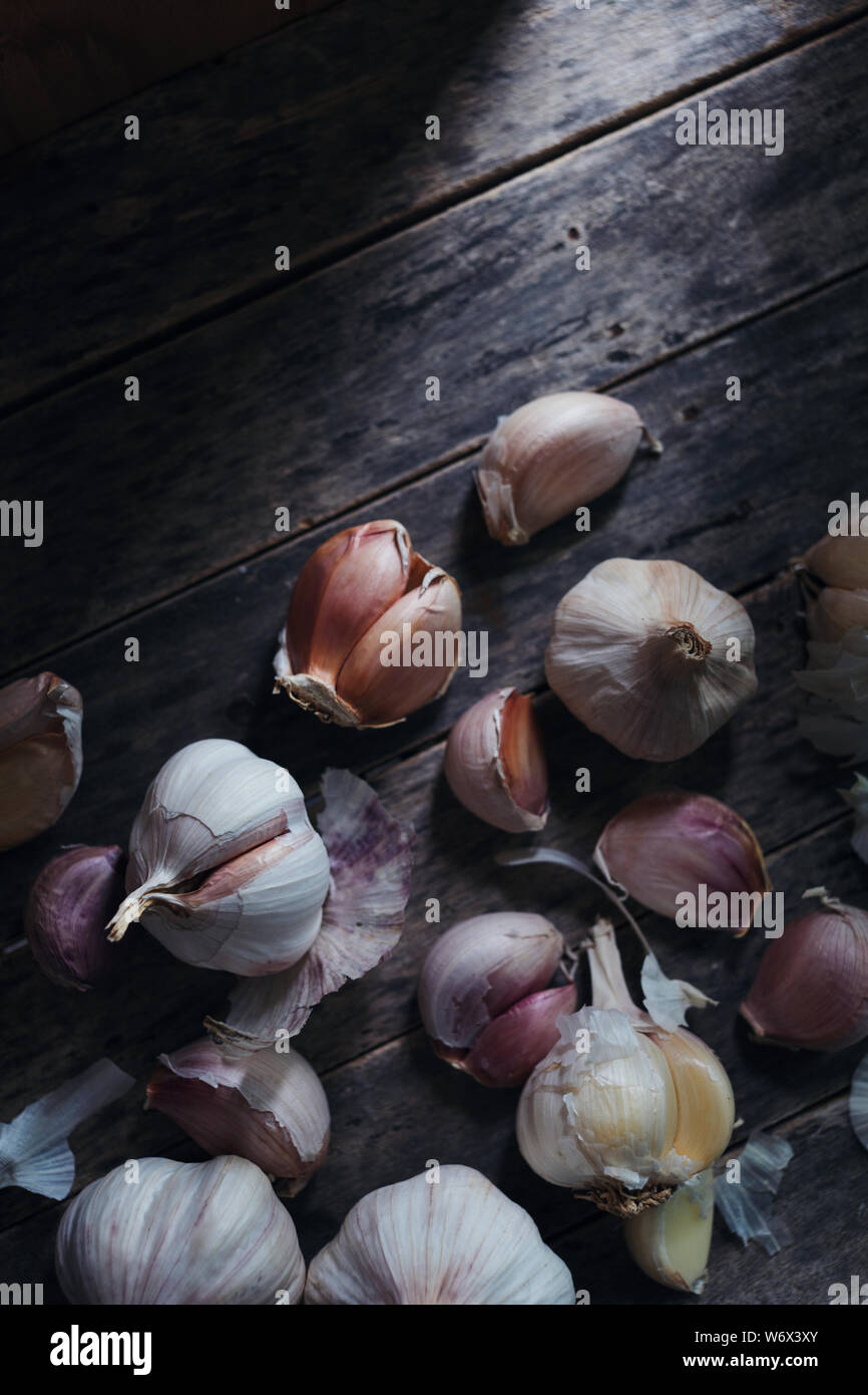 Garlic bulb and clove on rustic wooden Stock Photo Alamy