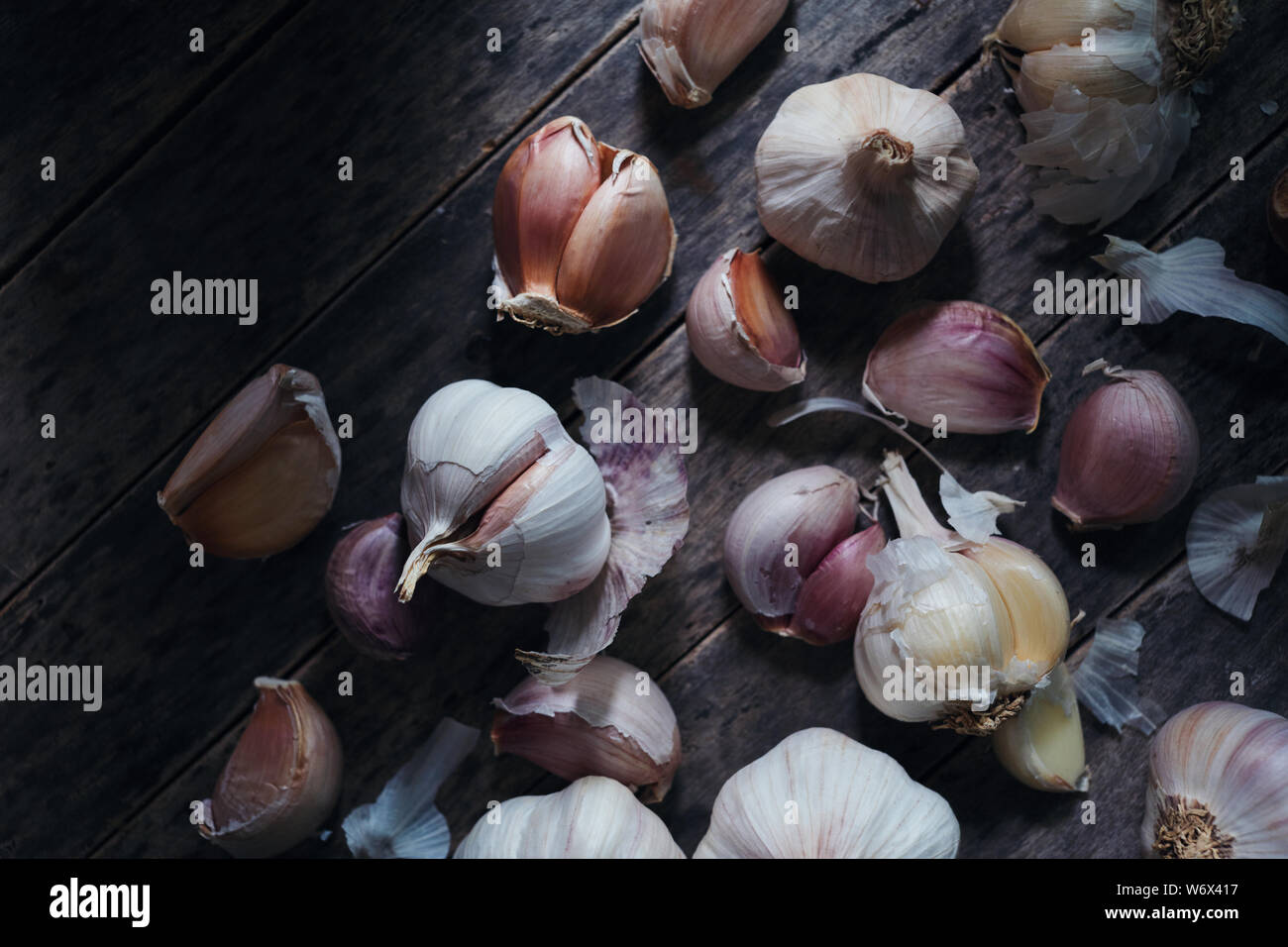 Garlic bulb and clove on rustic wooden Stock Photo